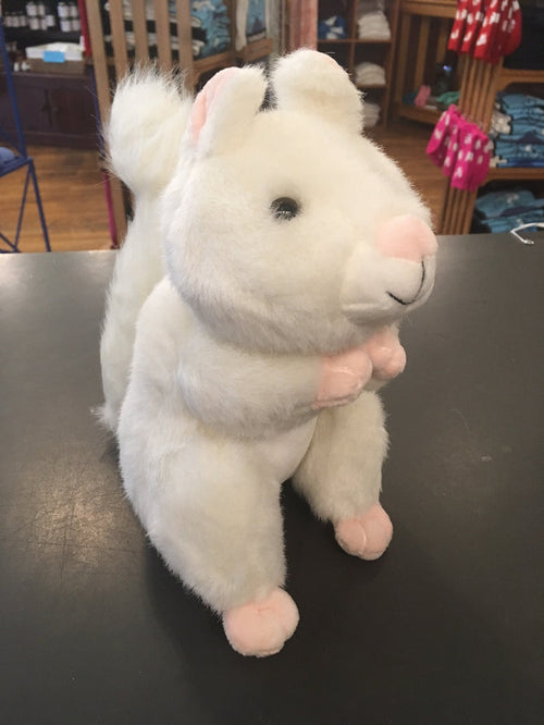 A large plush white squirrel with a pink nose, black eyes, and an extra fuzzy tail. It has pink paw pads and a pink nose.